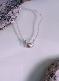Sterling silver eye pendant with a pupil in the shape of an apple core