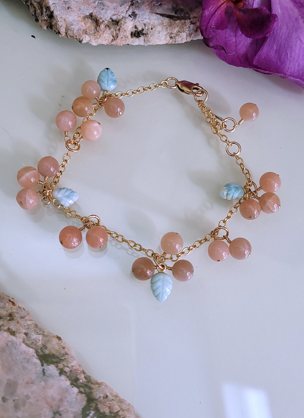 A gold-filled bracelet with sunstone and larimar beads