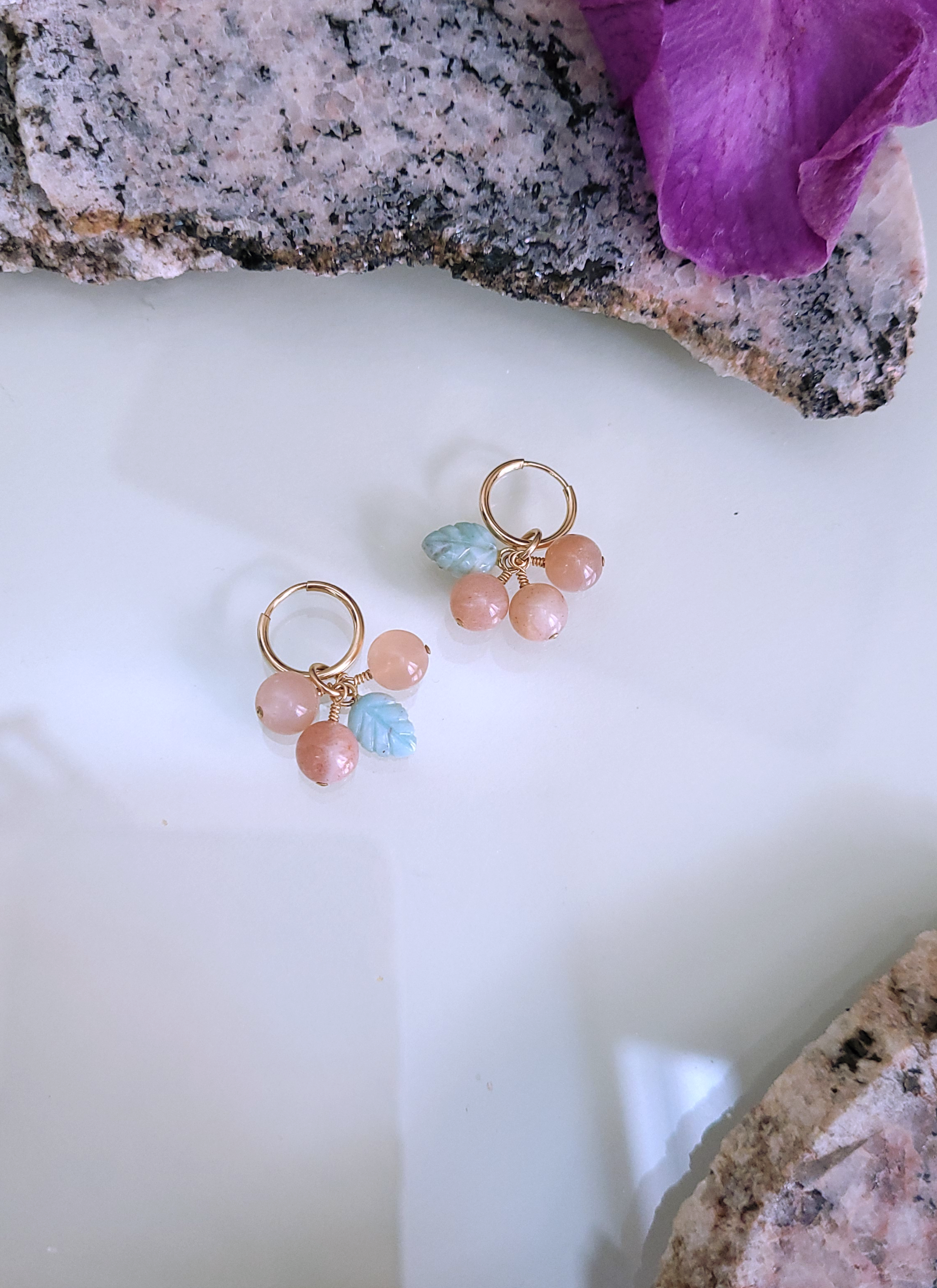 A pair of gold-filled hoops with sunstone and larimar beads